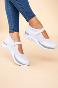 Women's white mary jane sneakers with buckled strap and mesh upper