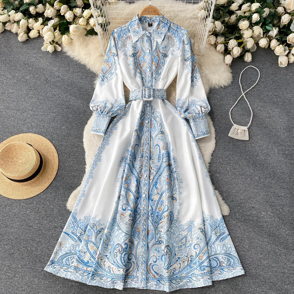 Women's blue printed a-line dress with tie belt and fitted bodice