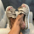 Women's beige woven wedge sandals with bow detail and platform heel