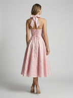Women's pink jacquard midi dress with halterneck and fitted bodice