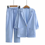 Women's blue linen jumpsuit with wide leg and relaxed fit