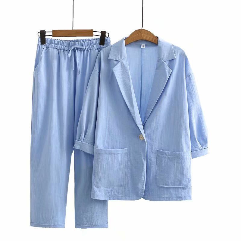 Women's blue linen jumpsuit with wide leg and relaxed fit