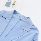 Women's blue linen jumpsuit with wide leg and relaxed fit