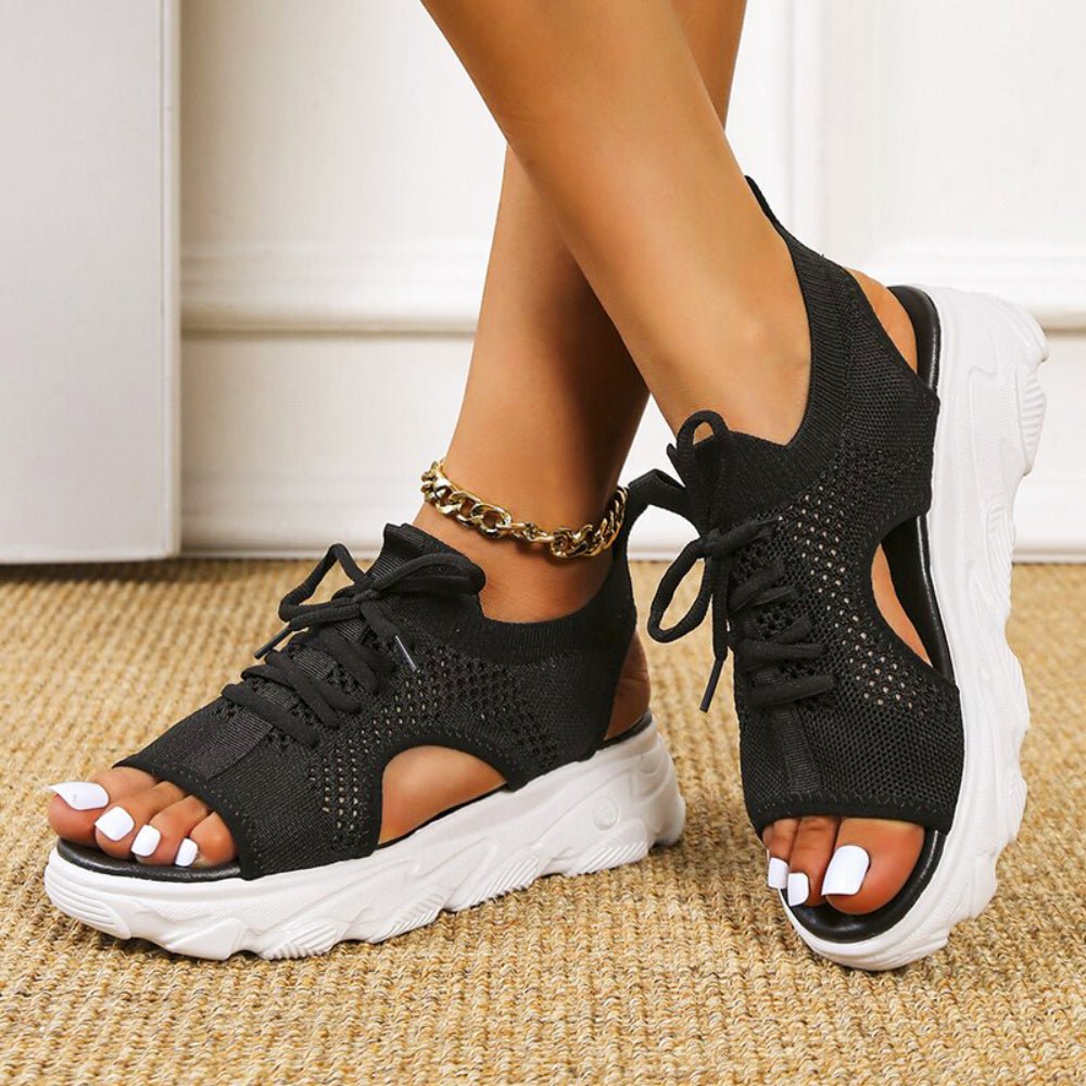 Women's black knit platform sandals with lace-up front and cushioned sole