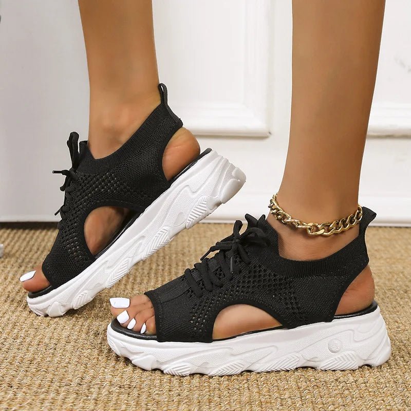 Women's black knit platform sandals with lace-up front and cushioned sole
