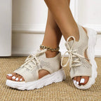 Women's black knit platform sandals with lace-up front and cushioned sole