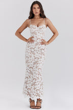 Women's white lace maxi dress with semi-sheer flowing skirt