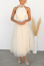 Women's light brown halterneck maxi dress with open shoulders