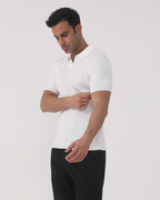 Men's white ribbed polo shirt with textured knit and classic collar