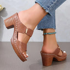 Women's black cushioned block heel sandals with woven straps