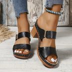 Women's black cushioned block heel sandals with woven straps