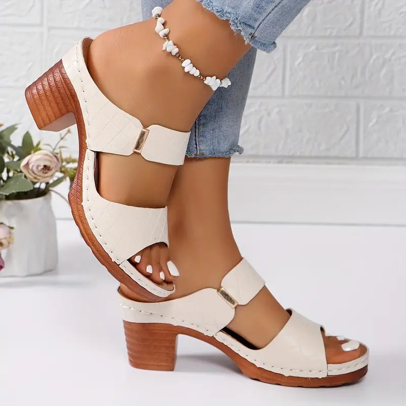Women's black cushioned block heel sandals with woven straps