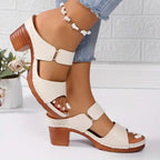 Women's black cushioned block heel sandals with woven straps