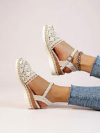 Women's beige espadrille wedge sandals with adjustable ankle strap