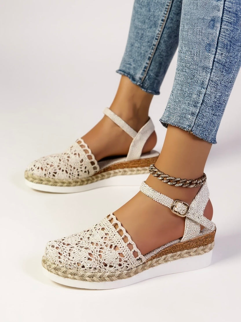 Women's beige espadrille wedge sandals with adjustable ankle strap