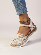 Women's beige espadrille wedge sandals with adjustable ankle strap