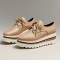 Women's beige lace-up platform oxford shoes on striped wedge sole