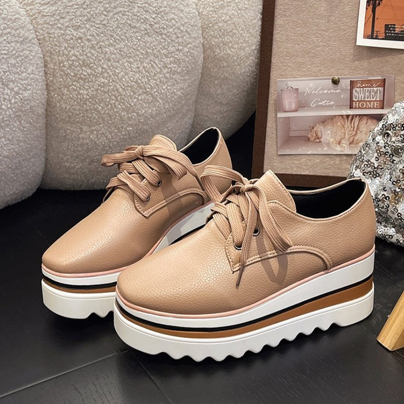 Women's beige lace-up platform oxford shoes on striped wedge sole