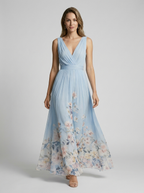 Women's light blue floral maxi dress with v-neckline and flowing skirt