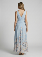 Women's light blue floral maxi dress with v-neckline and flowing skirt