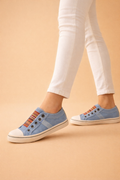 Women's blue slip-on sneakers with breathable knit upper