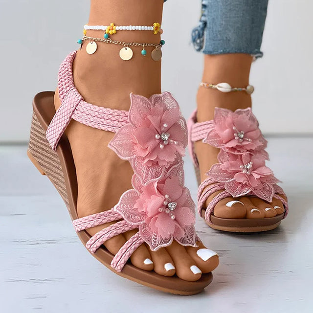 Women's pink floral wedge sandals with mid heel and open toe