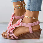 Women's pink floral wedge sandals with mid heel and open toe