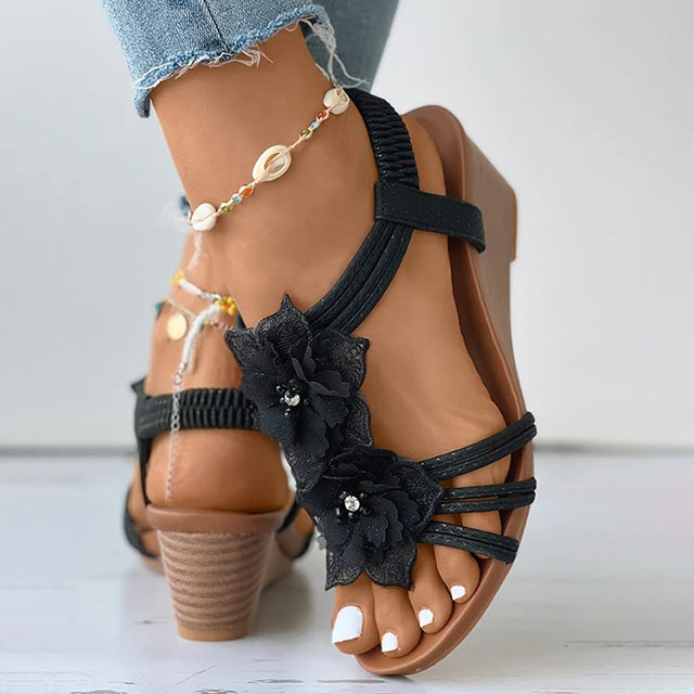 Women's pink floral wedge sandals with mid heel and open toe