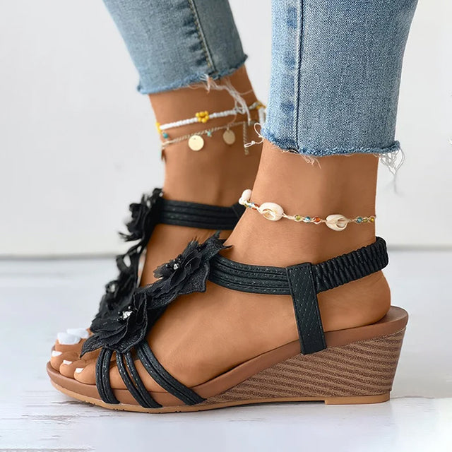 Women's pink floral wedge sandals with mid heel and open toe