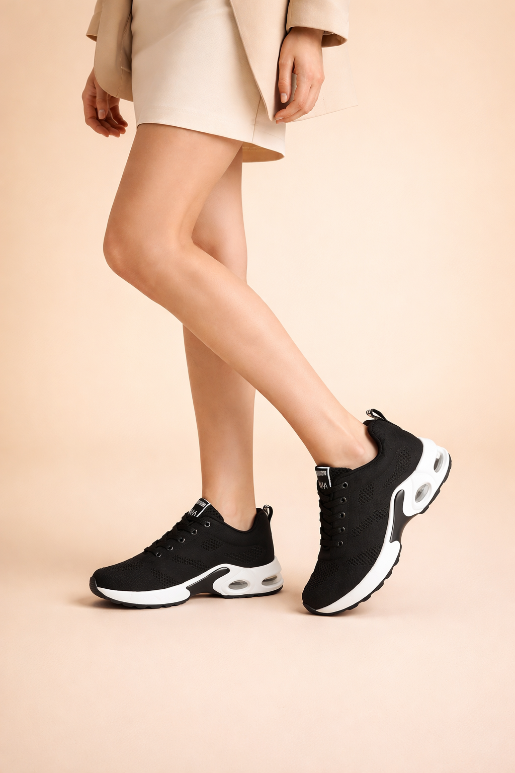Women's black lightweight sports trainers with breathable knit upper