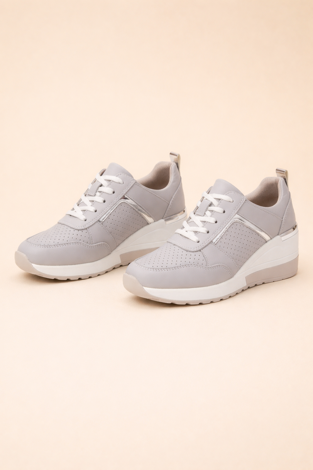 Women's white hidden wedge sneakers with perforated lace-up upper