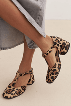 Women's light brown t-strap comfort shoes with animal print and buckle