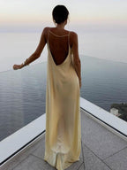 Women's light yellow satin slip maxi dress with fluid drape