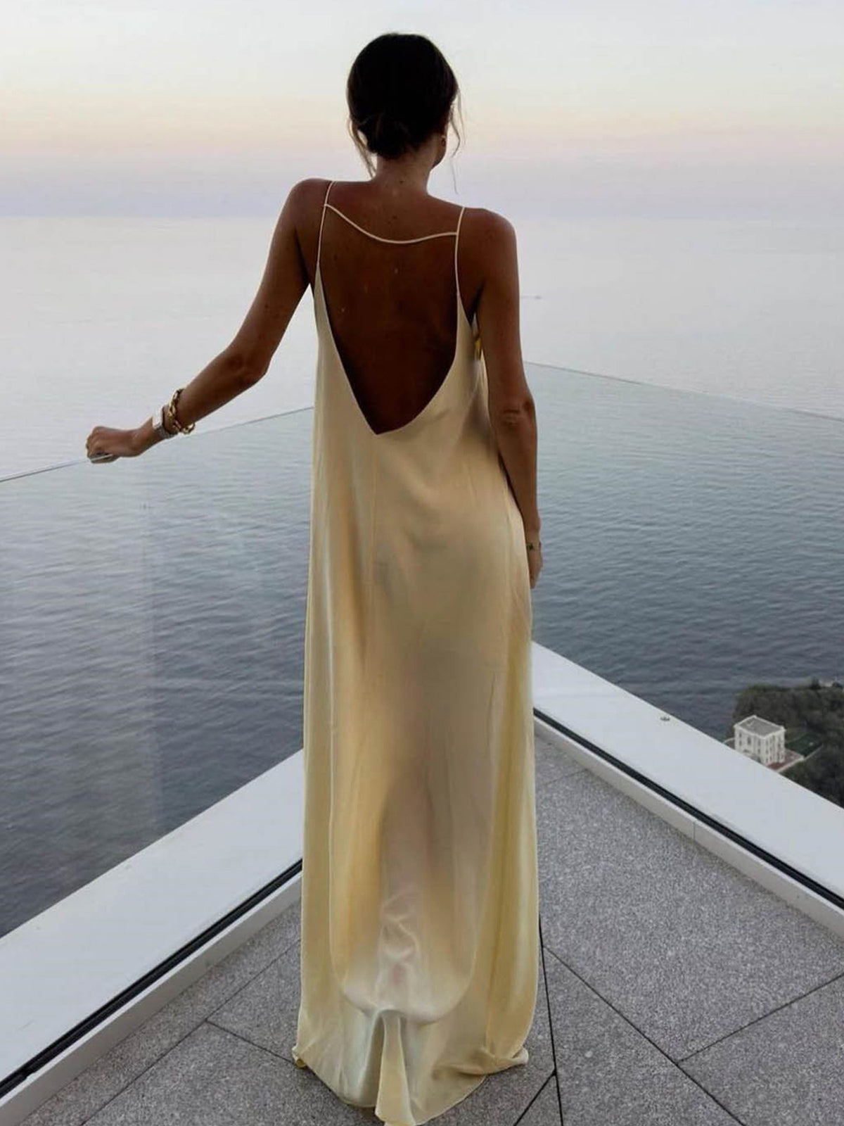 Women's light yellow satin slip maxi dress with fluid drape