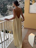 Women's light yellow satin slip maxi dress with fluid drape