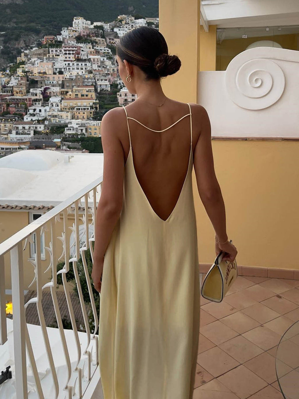 Women's light yellow satin slip maxi dress with fluid drape