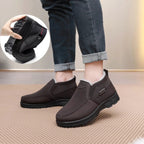 Men's black plush lined slip-on shoes with non-slip sole