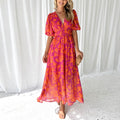 Women's floral maxi dress with deep v-neck and flowing skirt