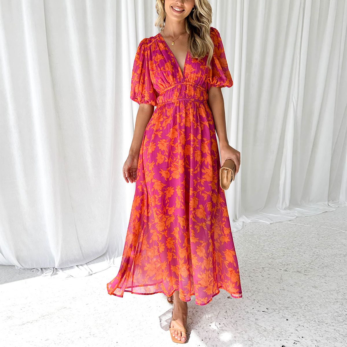 Women's floral maxi dress with deep v-neck and flowing skirt
