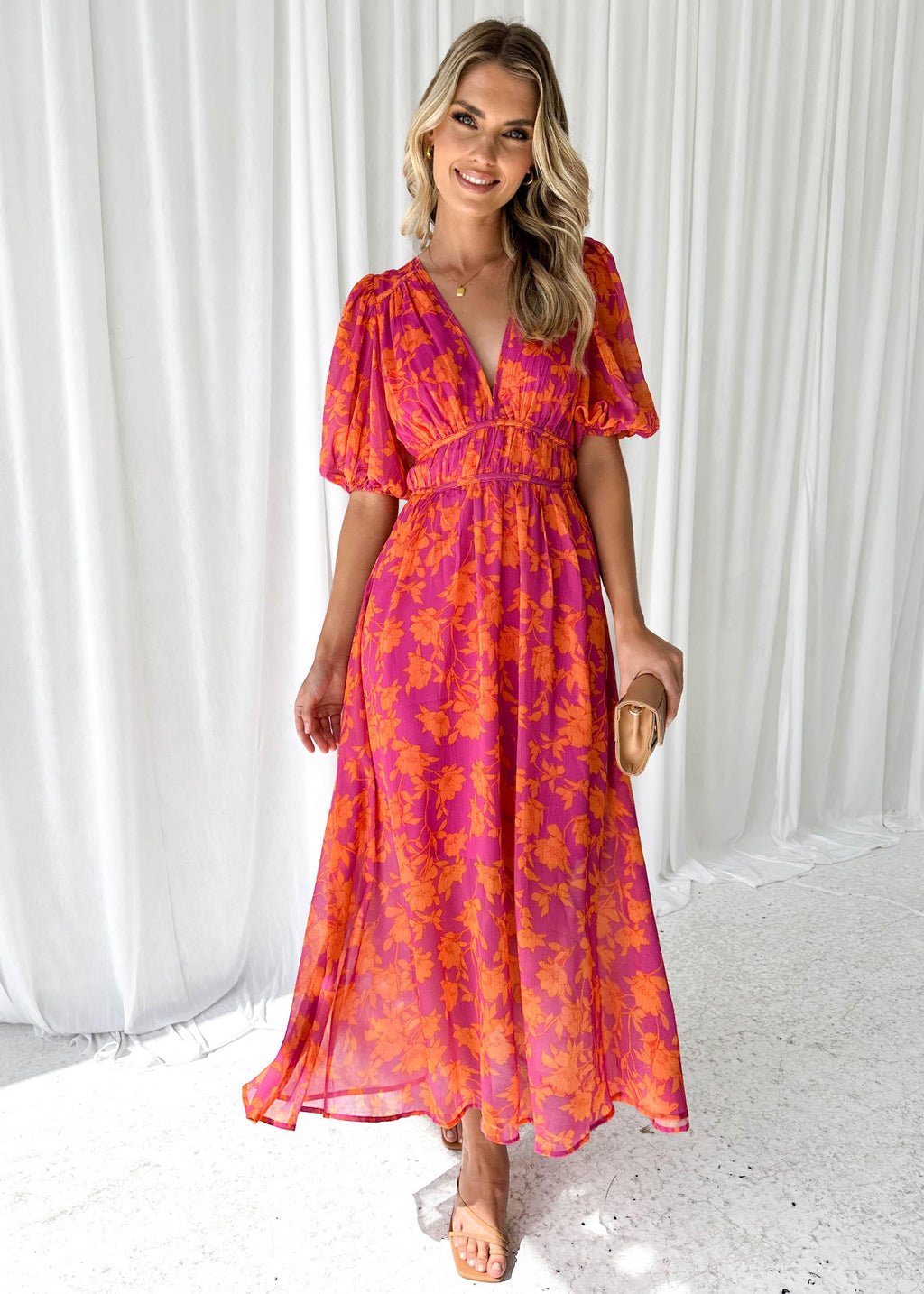 Women's floral maxi dress with deep v-neck and flowing skirt