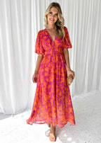 Women's floral maxi dress with deep v-neck and flowing skirt