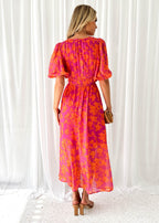 Women's floral maxi dress with deep v-neck and flowing skirt