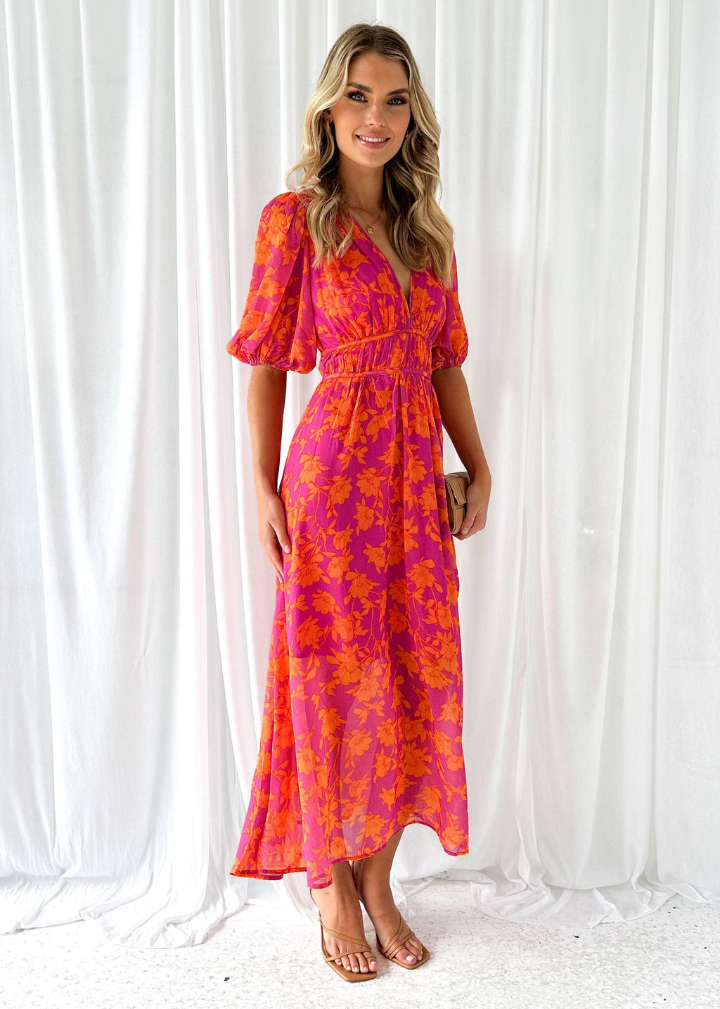 Women's floral maxi dress with deep v-neck and flowing skirt