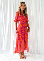 Women's floral maxi dress with deep v-neck and flowing skirt