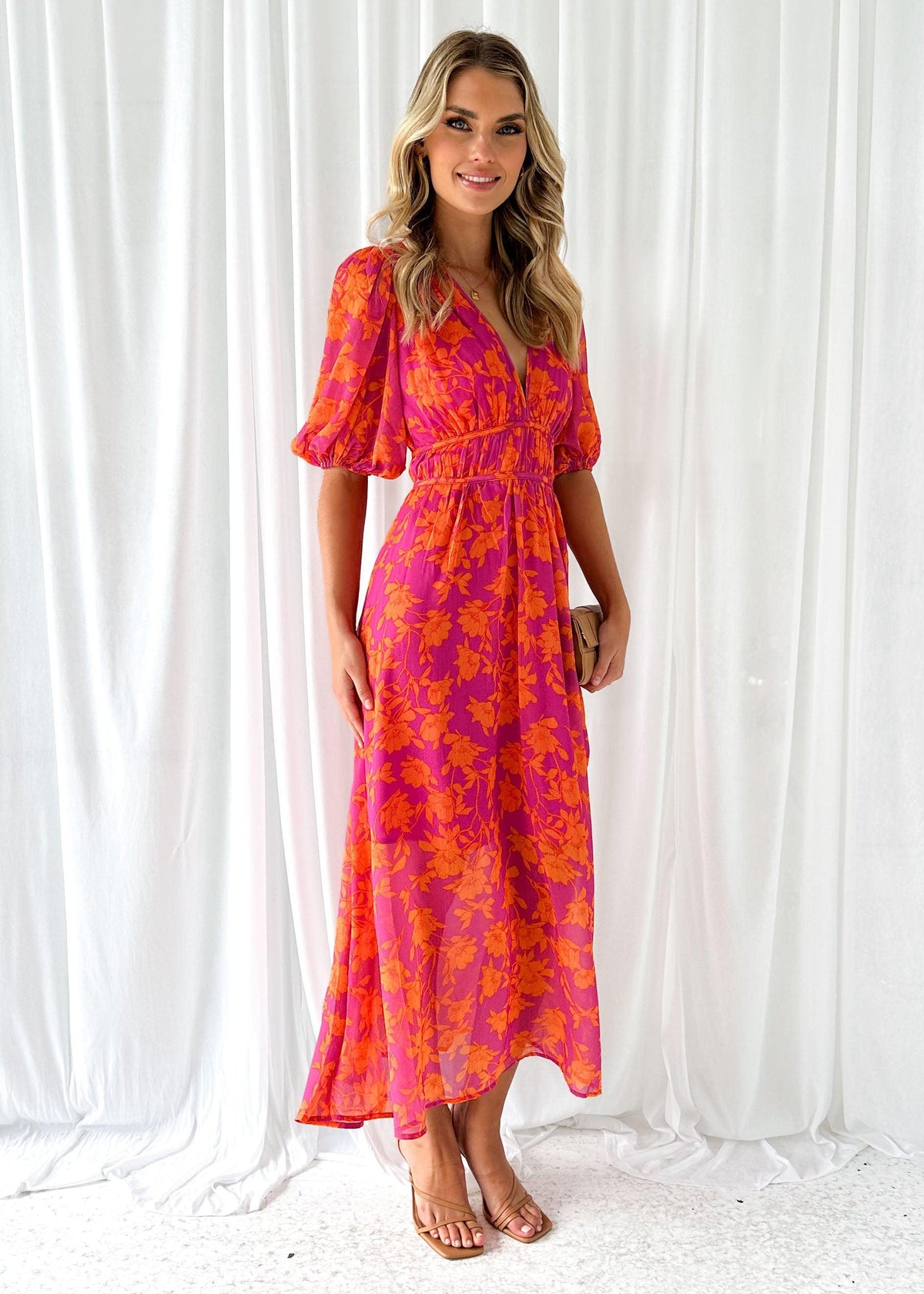 Women's floral maxi dress with deep v-neck and flowing skirt