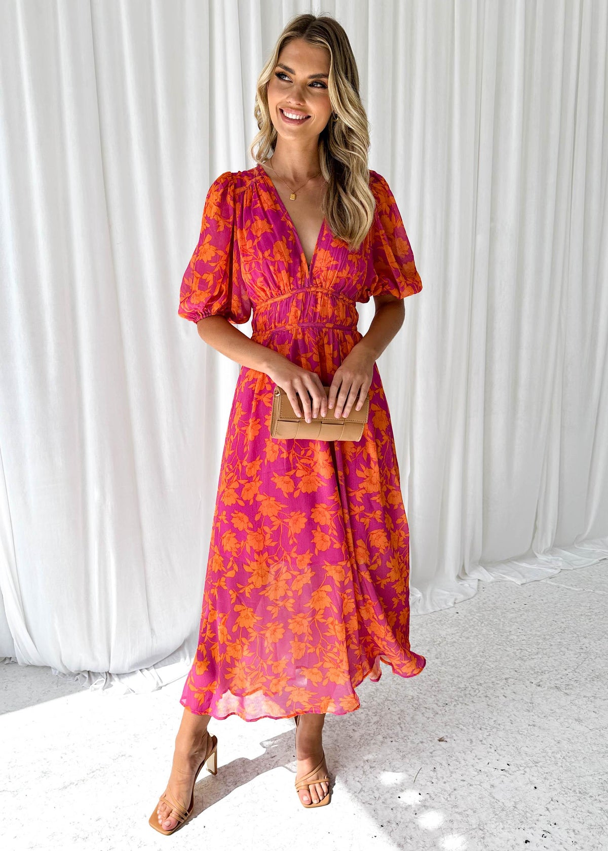 Women's floral maxi dress with deep v-neck and flowing skirt