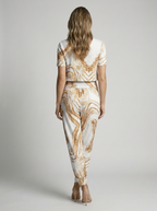 Women's white and gold printed two piece set with v-neck blouse and pants