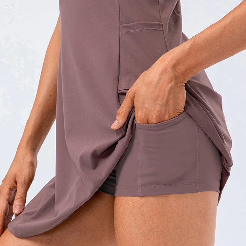 Women's brown tennis dress with built-in shorts and stretch fabric