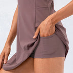Women's brown tennis dress with built-in shorts and stretch fabric