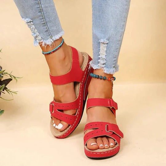 Women's red walking sandals with adjustable twin straps and flat footbed